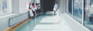 Group of residents and an attending in hallway